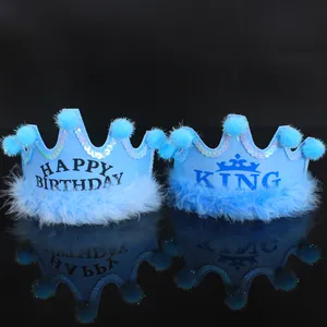 Two blue crown party hats for kids featuring HAPPY BIRTHDAY and KING designs with sequins