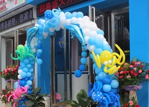 Blue and white decorative balloon arch with dolphin and octopus figures for grand event entry