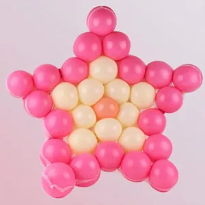 Star-shaped arrangement of pink and white 5-inch latex balloons for wedding decor