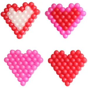 Red and pink heart-shaped latex balloon arrangements for wedding and party room decorations