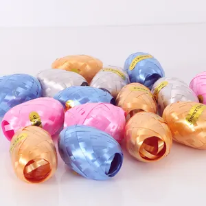 Close-up of colorful olive-shaped decorative ribbons for gift wrapping and party decor