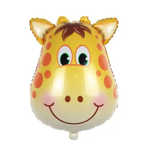 Detail view of a cute cartoon giraffe head foil balloon for birthday party decorations.