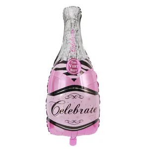 Detailed view of pink champagne bottle foil balloon featuring Celebrate text and foil texture