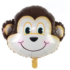 Close-up of a cute cartoon monkey head foil balloon for birthday party decorations