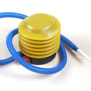 Close-up view of a yellow bellows manual air pump with blue hose for inflating balloons