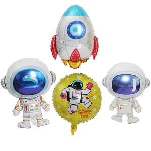 Detail shot of cartoon astronaut and rocket foil balloons for space theme party