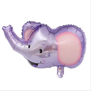 Close-up detail of a purple cartoon elephant head aluminum foil balloon for birthday party