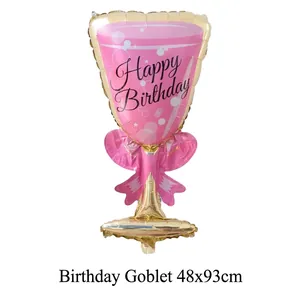 Detailed view of pink and gold champagne glass foil balloon for birthday party décor