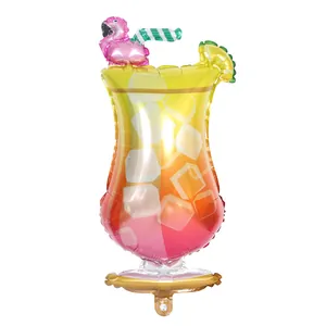 Detail of a tropical cocktail glass foil balloon with flamingo and ice patterns