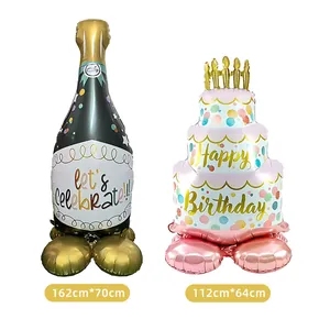 Large standing birthday balloons in cake and champagne bottle shapes for party decor