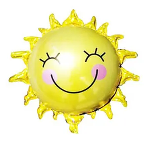 Cute yellow sun foil balloon with a smiling face for baby birthday party decorations