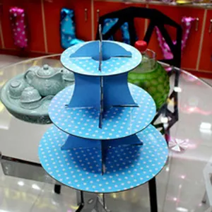 Close-up detail of a 3-tier blue polka dot cardboard cake stand for children party displays