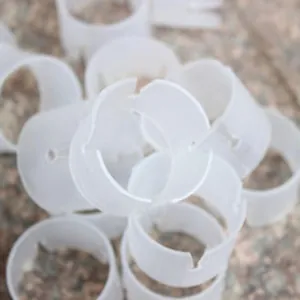 Close-up detail of white plastic balloon ring buckles for festive arch decoration