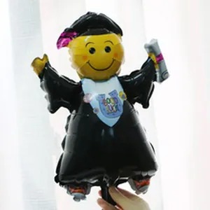 Close-up detail of graduation themed smiley doctor foil balloon for party decoration