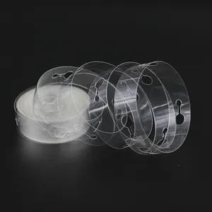 Detailed view of a transparent plastic balloon arch strip with multiple pre-punched holes