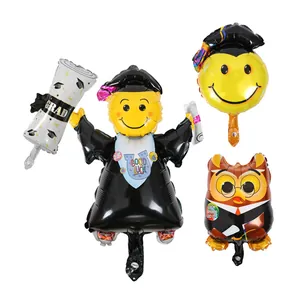 Set of graduation foil balloons featuring smiling doctor, owl, and GRAD scroll
