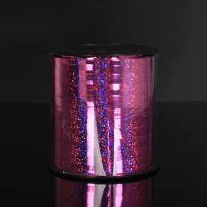 Macro detail of pink holographic laser ribbon with glitter for balloon decoration