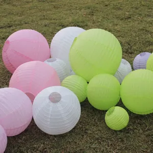 Group of assorted colorful round paper lanterns for festive outdoor wedding garden decor