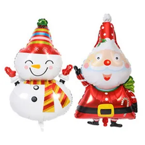 Close-up of festive Santa Claus and Snowman foil balloons for Christmas decorations