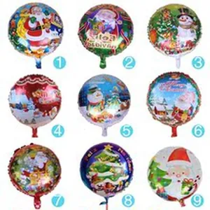 Colección de nueve globos navideños redondos de papel de aluminio con motivos festivos.