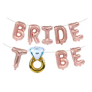 Detailed view of the rose gold BRIDE TO BE foil balloon set with a diamond ring.