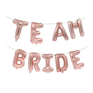 Detailed view of rose gold foil TEAM BRIDE balloon set for bachelorette party decor