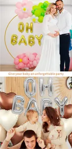 Golden and silver OH BABY foil balloons displayed in warm family party settings