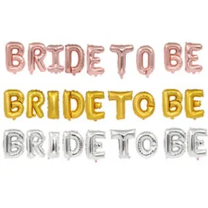 Detail view of BRIDE TO BE foil letter balloons in rose gold, gold, and silver finishes.