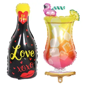 Detailed view of love wine bottle and flamingo cocktail glass party foil balloons