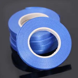 Detail shot of blue balloon ribbon rolls for wedding and birthday party decor.