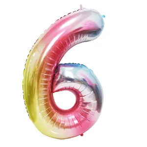 Close-up view of a large 40-inch rainbow gradient foil balloon shaped like the number 6