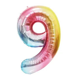 Close-up of a 40-inch rainbow gradient number 9 foil balloon with metallic reflective finish