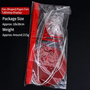 Detail view of the packaged red balloon and paper fan table display stand kit with base