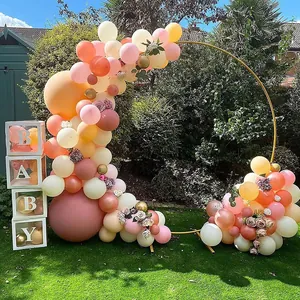 Gold metal circle balloon arch and BABY boxes for outdoor garden party decoration.