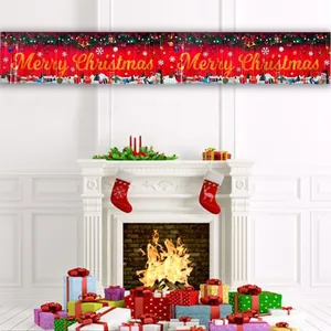 Large red 'Merry Christmas' banner displayed over a white fireplace with festive gift boxes