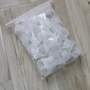 Bulk pack of white plastic balloon arch ring buckles in a zip-lock bag