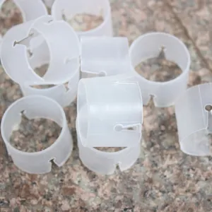 Close-up of white plastic balloon arch ring buckles for wedding arch decoration DIY