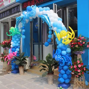 Detail view of a decorative blue and white balloon arch created with plastic ring clips