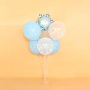 Assorted blue and white snowflake balloons on a transparent table float stand for Christmas