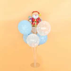 Desktop Christmas balloon stand featuring Santa foil and snowflake latex balloons