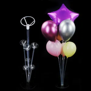 Detail of a transparent balloon stand with colorful balloons on a black background