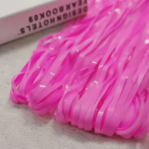 Detailed macro view of vibrant pink metallic fringe curtain for party backdrop decoration