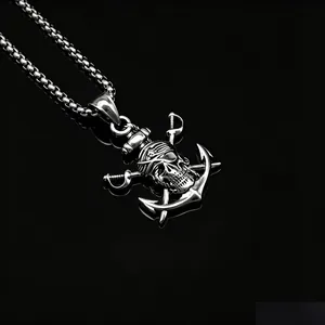 Close-up detail of a silver stainless steel pirate skull anchor pendant with crossed swords.
