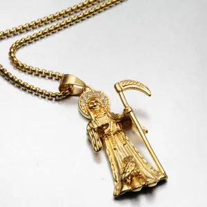 Close-up of hip hop gold Santa Muerte pendant necklace with intricate engraved details