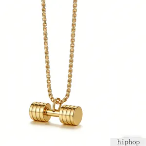 Detailed macro view of a polished gold titanium steel dumbbell pendant on a box chain.