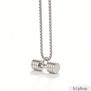 Close-up of a silver titanium steel barbell pendant with a sturdy square box chain