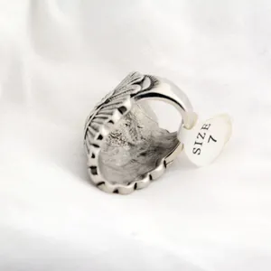 Detailed close-up of a men's vintage Indian chief ring featuring a size 7 tag