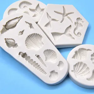 Detailed view of sea shell and mermaid tail silicone molds for DIY resin crafts