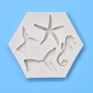 Detail of hexagonal silicone mold with starfish, seahorse, and mermaid tail patterns