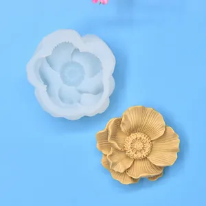 High detail 3D flower silicone mold displayed alongside a finished yellow wax flower model